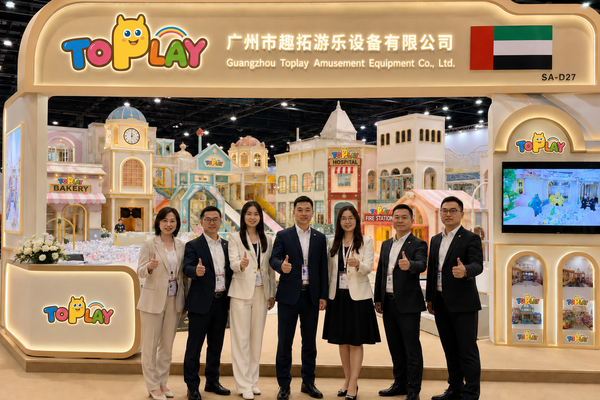 Toplay trade-fair display with a role-play town, ball pit and themed façades.